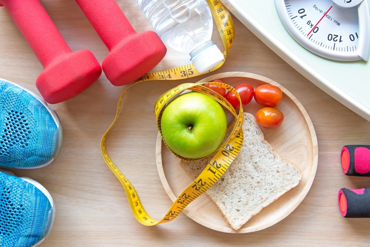 healthy snacks, weights, and sneakers